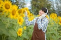 Asian agriculture is resting in the sunflower field. Happy after work Royalty Free Stock Photo