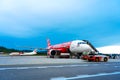 A322 Asian airline passenger plane boarding passengers stairway. At the airport on the island of Langkawi Royalty Free Stock Photo