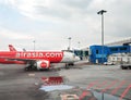 An Asian Airlines passenger airliner parked outside the airport terminal