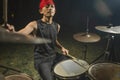 Asian American mixed teenager playing drums at home garden . cool and handsome young boy practicing on drum kit rehearsing Royalty Free Stock Photo