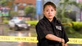 Asian American Woman Police Officer at Crime scene