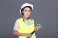 Asian Architect Engineer woman in white hard hat, safety vast, p Royalty Free Stock Photo