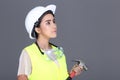 Asian Architect Engineer woman in white hard hat, safety vast, p Royalty Free Stock Photo