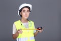 Asian Architect Engineer woman in white hard hat, safety vast, p Royalty Free Stock Photo