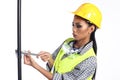 Asian Architect Engineer woman in yellow hard hat, safety vast Royalty Free Stock Photo