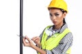 Asian Architect Engineer woman in yellow hard hat, safety vast Royalty Free Stock Photo