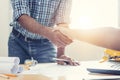 Asian architect man and businesswomen Handshaking.