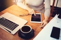 Asian architect woman working at home with tablet and blueprints Royalty Free Stock Photo