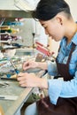 Asian Artist in Lampworking in Studio