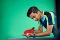 Asian athlete ready to serve during a ping pong match Royalty Free Stock Photo