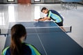 Asian athlete ready to serve during a ping pong match Royalty Free Stock Photo