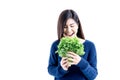 Asian attractive woman eating green fresh vegetables on white background Royalty Free Stock Photo