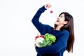 Asian attractive woman Holding and smile, happy with eating fresh vegetables and fruits Royalty Free Stock Photo