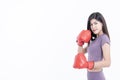 Asian attractive woman Wearing red boxing gloves, is good shape Royalty Free Stock Photo