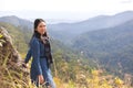 Asian attractive young woman traveler tourist standing  looking at mountain valley nature landscape summer scenery feeling Royalty Free Stock Photo