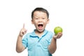 Asian baby boy holding and eating red apple, isolated on white Royalty Free Stock Photo