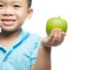 Asian baby boy holding and eating red apple, isolated on white Royalty Free Stock Photo