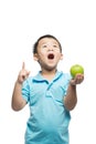 Asian baby boy holding and eating red apple, isolated on white Royalty Free Stock Photo