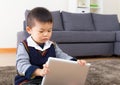 Asian baby boy using digital tablet Royalty Free Stock Photo