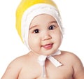 Asian baby boy in a yellow cap Royalty Free Stock Photo