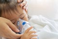 Asian baby girl breathing treatment with mother take care, at room hospital.