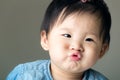 Asian baby girl purse lip Royalty Free Stock Photo