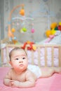 Asian baby girl scowl and tongue out Royalty Free Stock Photo