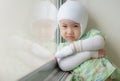 Asian baby girl are sick with Atopic dermatitis, She was wrapped with a bandage on the head neck arms and legs. Royalty Free Stock Photo