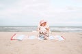 Asian baby girl sitting on beach chair and wearing sunglasses. Royalty Free Stock Photo