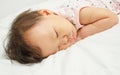 Asian baby girl sleeping on bed Royalty Free Stock Photo