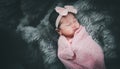 Asian baby girl sleeping on bed. Portrait baby girl studio lighting on fur bed. Royalty Free Stock Photo