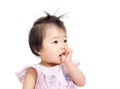 Asian baby girl suck finger into mouth Royalty Free Stock Photo