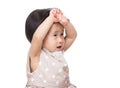 Asian baby girl touching her head Royalty Free Stock Photo