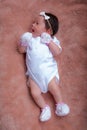 Asian baby baby girl wearing a tiny bow headband Royalty Free Stock Photo