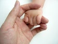 Asian baby hand in adult hand Royalty Free Stock Photo