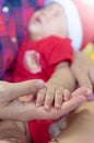 Asian baby hand on the adult hand Royalty Free Stock Photo