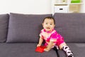 Asian baby holding red pocket with traditional chinese clothing Royalty Free Stock Photo