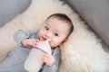 Asian baby infant eating milk from bottle, 9 months after birth Royalty Free Stock Photo