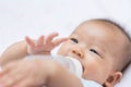 Asian baby infant enjoy drinking water from bottle Royalty Free Stock Photo