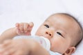 Asian baby infant enjoy drinking water from bottle Royalty Free Stock Photo