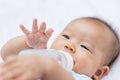 Asian baby infant enjoy drinking water from bottle Royalty Free Stock Photo