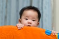 Asian baby in playpen Royalty Free Stock Photo