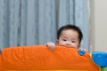 Asian baby in playpen Royalty Free Stock Photo