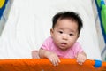Asian baby in playpen Royalty Free Stock Photo