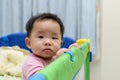 Asian baby in playpen Royalty Free Stock Photo