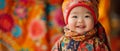 Asian Baby Posing Joyfully In Vibrant Clothing Against A Vivid Backdrop
