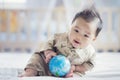 Asian baby in soldier uniform