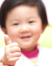 Asian baby thumb up