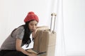 Asian backpack traveler woman using local map, sitting alone with luggage. Royalty Free Stock Photo
