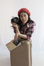 Asian backpack traveler woman using local map, sitting alone with luggage. Royalty Free Stock Photo